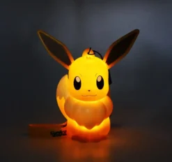 POKEMON - FIGURINE LUMINEUSE EVOLI AVEC DRAGONNE